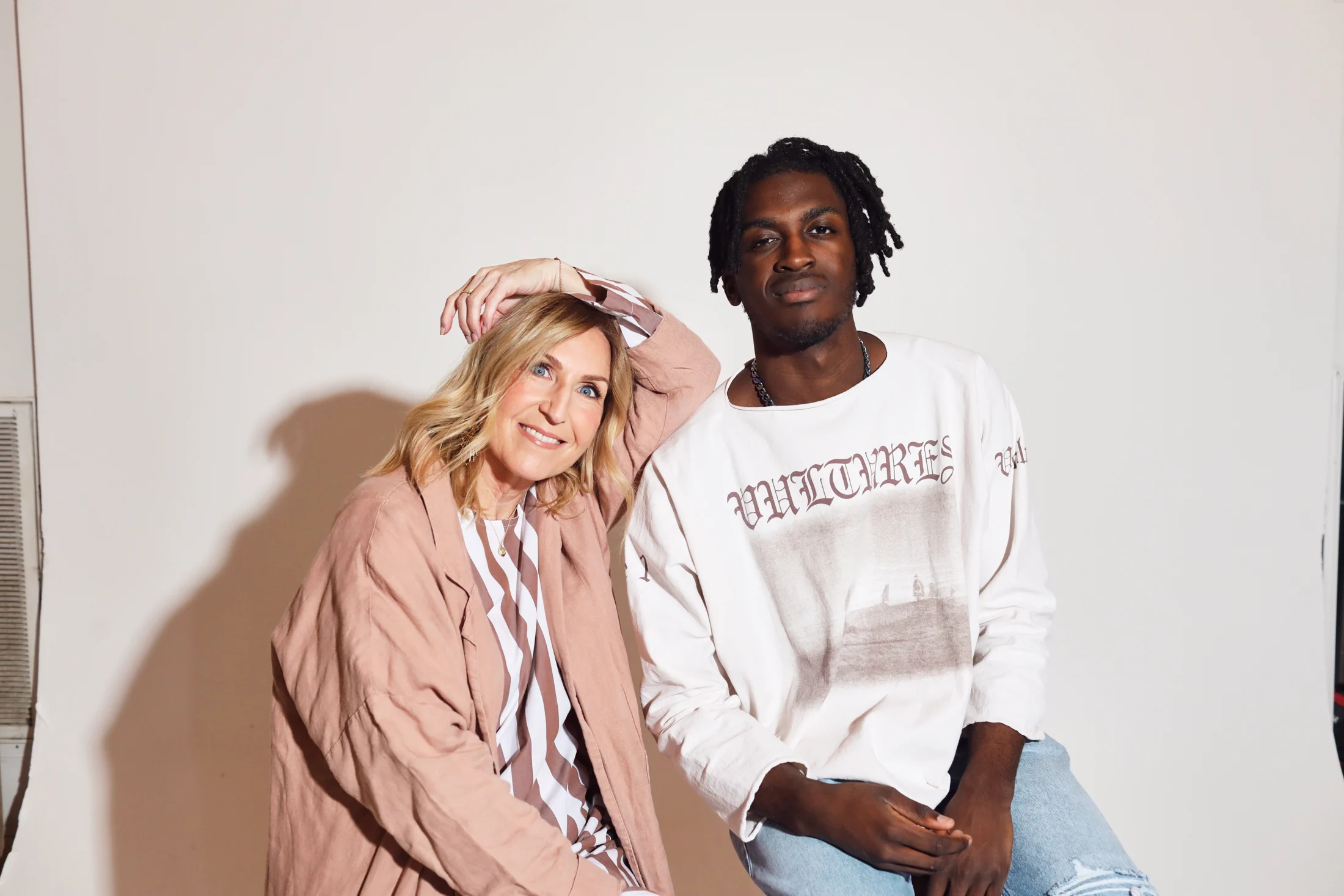 Rita and Justice leaning together and smiling