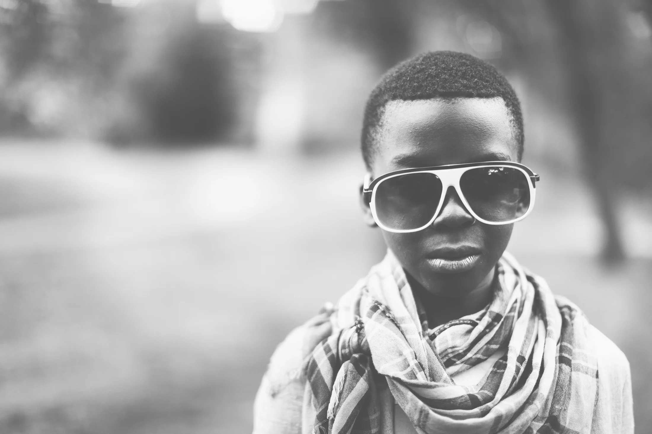 Justice as a child wearing sunglasses