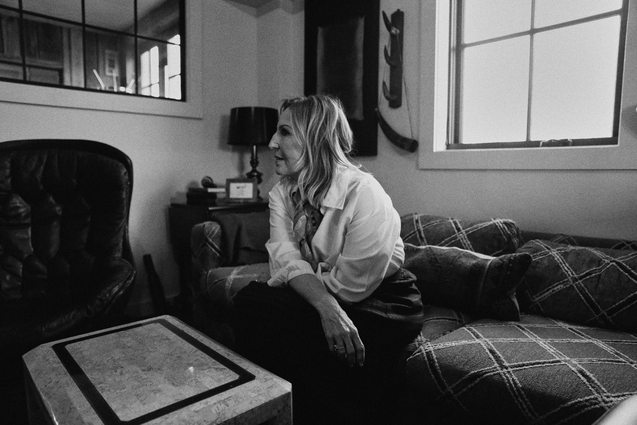 Rita sitting beside her piano